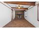Bright living room featuring hardwood floors, ceiling beams, and a brick fireplace at 1593 Westwood Dr, Charleston, SC 29412