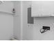 Utility room with exposed electrical hookups, a small shelf, and white cabinets at 1593 Westwood Dr, Charleston, SC 29412
