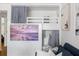 Living room featuring built-in bunk beds and a beach-themed television display at 1634 Live Oak Park, Seabrook Island, SC 29455