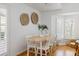 Bright dining room with seating for six and views of the backyard at 1634 Live Oak Park, Seabrook Island, SC 29455