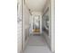 Inviting entryway with a stylish rug, screened door, and views into the home's interior at 1634 Live Oak Park, Seabrook Island, SC 29455