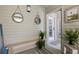 Coastal-style entryway with nautical decor, a wooden bench, and a view into the home at 1634 Live Oak Park, Seabrook Island, SC 29455