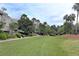 Low-rise building with ample lawn space, mature landscaping and palm trees at 1634 Live Oak Park, Seabrook Island, SC 29455