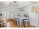 Well-lit kitchen features a large central island with seating, modern appliances, and abundant natural light at 1634 Live Oak Park, Seabrook Island, SC 29455