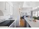 Bright kitchen featuring modern appliances, marble countertops, and an open layout to the living area at 1634 Live Oak Park, Seabrook Island, SC 29455