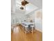 Modern kitchen with a large central island, seating, and ample natural light from high ceilings and windows at 1634 Live Oak Park, Seabrook Island, SC 29455