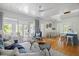 Bright living room with hardwood floors, stylish furnishings, and sliding glass doors to outdoor space at 1634 Live Oak Park, Seabrook Island, SC 29455