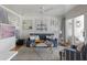 Charming living room features a blue sofa, nautical decor, and a cozy sitting area with sliding doors at 1634 Live Oak Park, Seabrook Island, SC 29455