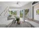 Cozy sunroom featuring wicker furniture, abundant natural light, and peaceful garden views at 1634 Live Oak Park, Seabrook Island, SC 29455