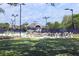 View of the community tennis courts, with tables and chairs for socializing at 1634 Live Oak Park, Seabrook Island, SC 29455