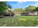 Wide view of a property with a large yard and outbuildings at 1671 Dawson Branch Rd, Summerville, SC 29483