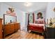This bedroom features wood floors, neutral walls, and unique decor at 1671 Dawson Branch Rd, Summerville, SC 29483