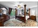 Spacious bedroom suite with wood flooring, dark wood trim and many windows at 1671 Dawson Branch Rd, Summerville, SC 29483