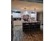 Modern kitchen featuring an island with seating, brick accents, pendant lights, and stainless-steel appliances at 1671 Dawson Branch Rd, Summerville, SC 29483