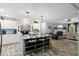 Open concept kitchen features a breakfast bar, brick accent wall and seamlessly connects to the living area at 1671 Dawson Branch Rd, Summerville, SC 29483