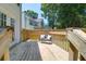 Inviting wood deck with an outdoor bench, perfect for relaxing and enjoying the serene backyard view at 1703 Dotterers Run, Charleston, SC 29414