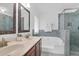 Spacious bathroom featuring double sinks, a large tub, and a glass-enclosed shower at 1703 Dotterers Run, Charleston, SC 29414