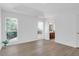Spacious bedroom with hardwood floors, abundant natural light, and an ensuite bathroom at 1703 Dotterers Run, Charleston, SC 29414