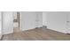Open bedroom view featuring hardwood flooring, double doors, and a bathroom with tile at 1703 Dotterers Run, Charleston, SC 29414