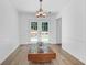 Clean dining room boasting hardwood floors, modern chandelier, and French doors at 1703 Dotterers Run, Charleston, SC 29414