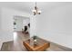 Dining room with hardwood floors, chandelier, and adjacent to living room and entryway at 1703 Dotterers Run, Charleston, SC 29414