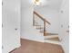 Bright entryway featuring stairs with wood railing and tiled floors at 1703 Dotterers Run, Charleston, SC 29414