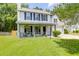 Charming two-story home featuring a covered front porch and well-maintained landscaping at 1703 Dotterers Run, Charleston, SC 29414