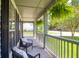 Welcoming front porch with hanging ferns and comfortable seating, perfect for relaxing at 1703 Dotterers Run, Charleston, SC 29414