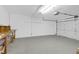 Spacious, clean two car garage with concrete flooring, overhead lighting, and an automatic door opener at 1703 Dotterers Run, Charleston, SC 29414