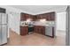 Well-equipped kitchen featuring stainless steel appliances and dark wood cabinets at 1703 Dotterers Run, Charleston, SC 29414
