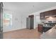 A bright kitchen featuring tile flooring, stainless appliances and dark cabinets at 1703 Dotterers Run, Charleston, SC 29414