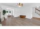 Spacious living room with hardwood floors, natural light, and access to other rooms at 1703 Dotterers Run, Charleston, SC 29414
