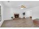 Inviting living room with a brick fireplace, wood floors, and a ceiling fan at 1703 Dotterers Run, Charleston, SC 29414