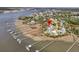 Stunning aerial view of a waterfront home with private boat docks on the marsh at 1720 Bowline Dr, Mount Pleasant, SC 29466