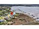 Aerial view of the home with waterfront access, private dock and the marshy shoreline at 1720 Bowline Dr, Mount Pleasant, SC 29466