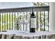 Wine bottle and glasses on a balcony table with a picturesque outdoor backdrop at 1720 Bowline Dr, Mount Pleasant, SC 29466
