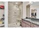 Modern bathroom featuring a tiled glass shower, marble vanity, and closet space at 1720 Bowline Dr, Mount Pleasant, SC 29466