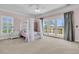 Cozy bedroom featuring a canopy bed and access to the balcony at 1720 Bowline Dr, Mount Pleasant, SC 29466
