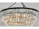 Close-up of the modern chandelier with tiered crystal accents, a statement piece for the home at 1720 Bowline Dr, Mount Pleasant, SC 29466