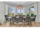 Dining room featuring multiple windows, grey chairs and light hardwood floors at 1720 Bowline Dr, Mount Pleasant, SC 29466