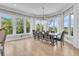 Bright dining room with views, light hardwood floors, and large chandelier at 1720 Bowline Dr, Mount Pleasant, SC 29466