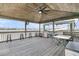 Interior view of a covered dock area with seating, a grill, table, ceiling fan and boat lift at 1720 Bowline Dr, Mount Pleasant, SC 29466