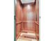 Interior view of a modern residential elevator with wood paneling and a patterned floor at 1720 Bowline Dr, Mount Pleasant, SC 29466