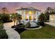 Beautiful two-story home with a circular driveway, manicured lawn, and prominent front columns at 1720 Bowline Dr, Mount Pleasant, SC 29466
