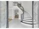 Grand foyer showcases a curved staircase, marble floors, and views into the living room at 1720 Bowline Dr, Mount Pleasant, SC 29466