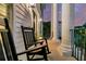 Inviting front porch with rocking chairs and elegant pillars offers a relaxing outdoor space at 1720 Bowline Dr, Mount Pleasant, SC 29466