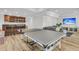 Large recreation room featuring a wet bar, ping pong table, lounge area, and sleek wood flooring at 1720 Bowline Dr, Mount Pleasant, SC 29466