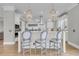Elegant kitchen features a center island with barstool seating, stylish pendants, and state-of-the-art appliances at 1720 Bowline Dr, Mount Pleasant, SC 29466