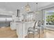 Open and bright kitchen with stainless steel refrigerator and hardwood floors at 1720 Bowline Dr, Mount Pleasant, SC 29466