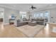 Spacious living room with hardwood floors, area rug, comfortable seating, and large windows for ample natural light at 1720 Bowline Dr, Mount Pleasant, SC 29466